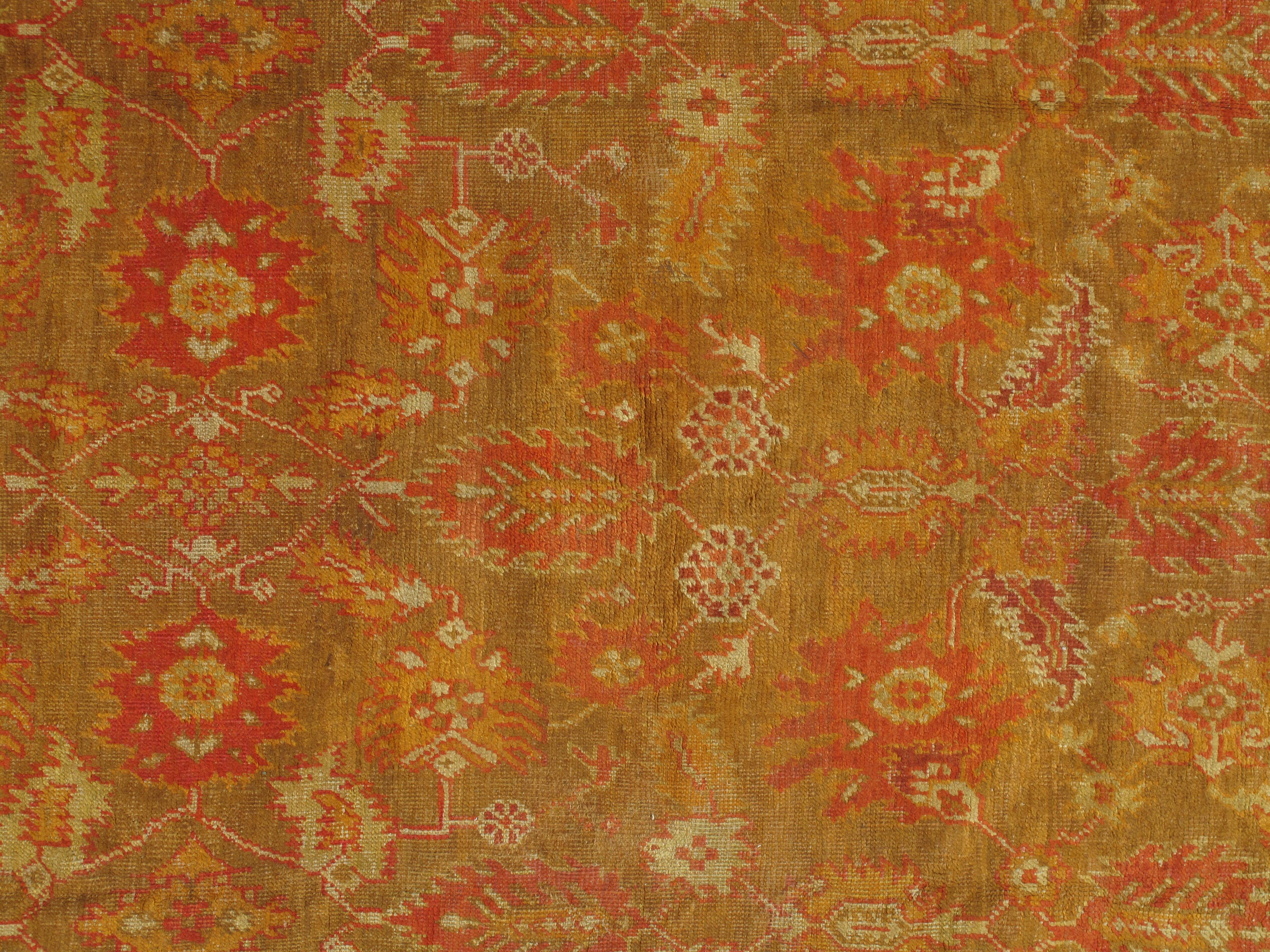 Turkish carpet from Oushak with a combination of soft colors having an all-over design. Finely woven, having the most superb wool found in the mountains of Anatolia. This is a fine example of an antique Oushak. 

Size: 9'5