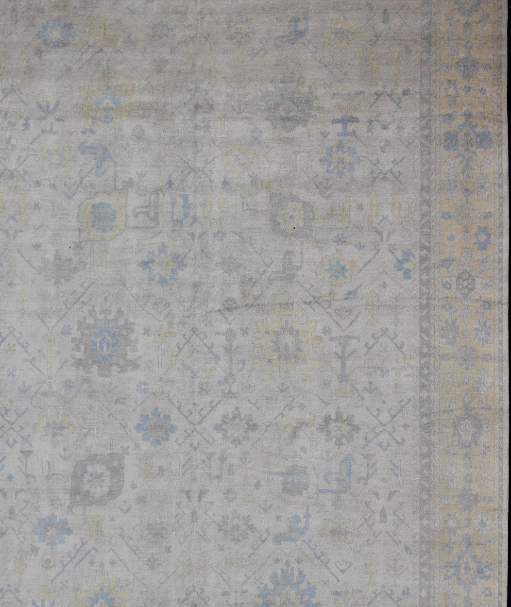 Oushak design rug in gray, silver, light blue and charcoal with all-over geometric design, rug OB-9356761, country of origin / type: India/ Oushak

This hand knotted Oushak rug features a beautiful all-over design rendered in grays, L. blues,
