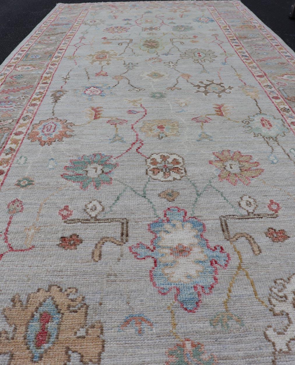 Measures: 4'0 x 10'2 
Oushak Gallery Rug with Soft Ivory Field and Accents in Light Blue  4'0 x 10'2. Keivan Woven Arts. rug /AWR-71 / Early 21st Century, Turkish Oushak.

This elegant Oushak gallery rug features a soft ivory background adorned with