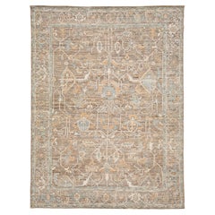 Alfombra moderna de lana inspirada en el estilo Oushak en tonos tierra, azul pizarra apagado y ocre