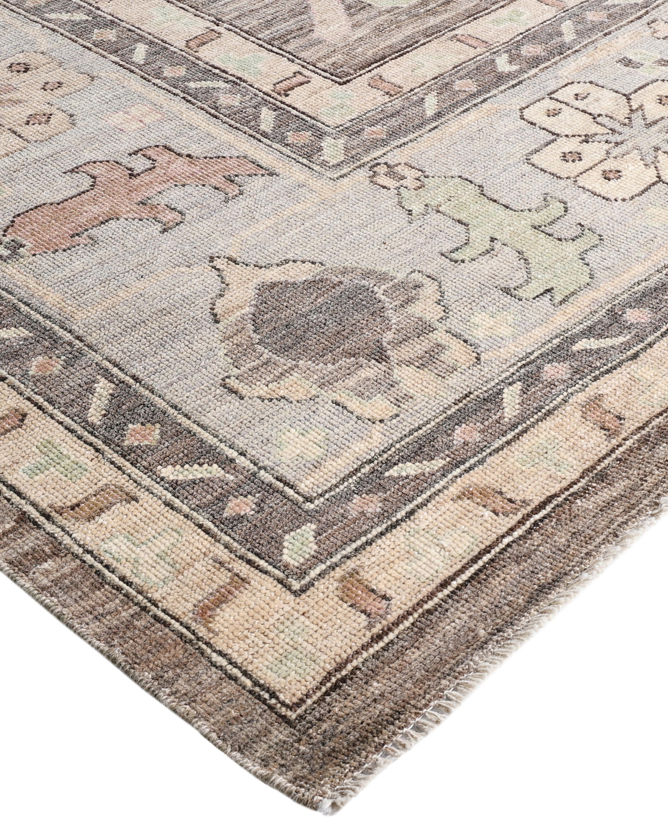 Oushak rugs are known for their soft, muted color palettes and large-scale, flowing designs. They often feature soft tones like beige, cream, gold, and light blue, with motifs that include palmettes, vines, and geometric shapes. These rugs are