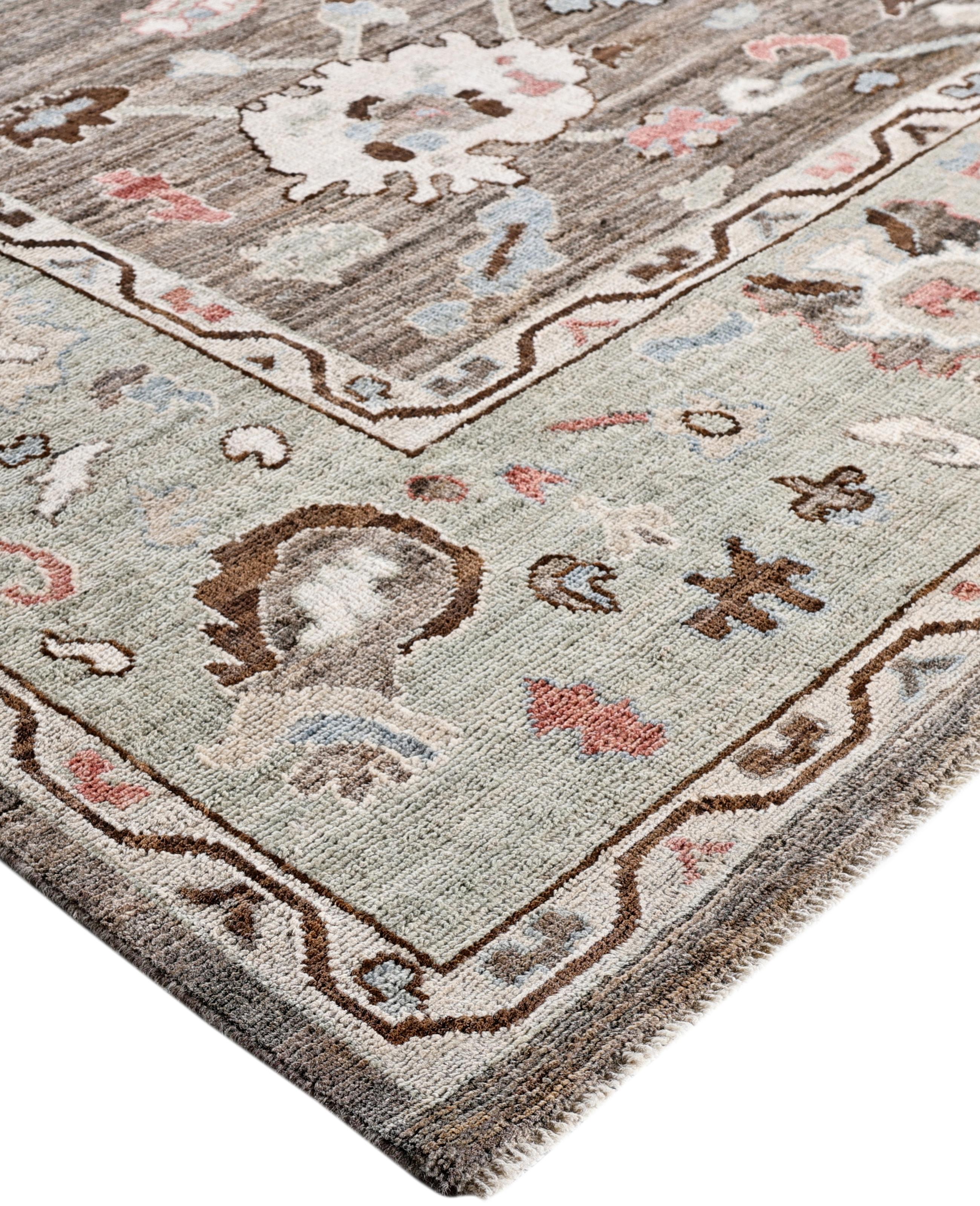 Oushak rugs are known for their soft, muted color palettes and large-scale, flowing designs. They often feature soft tones like beige, cream, gold, and light blue, with motifs that include palmettes, vines, and geometric shapes. These rugs are