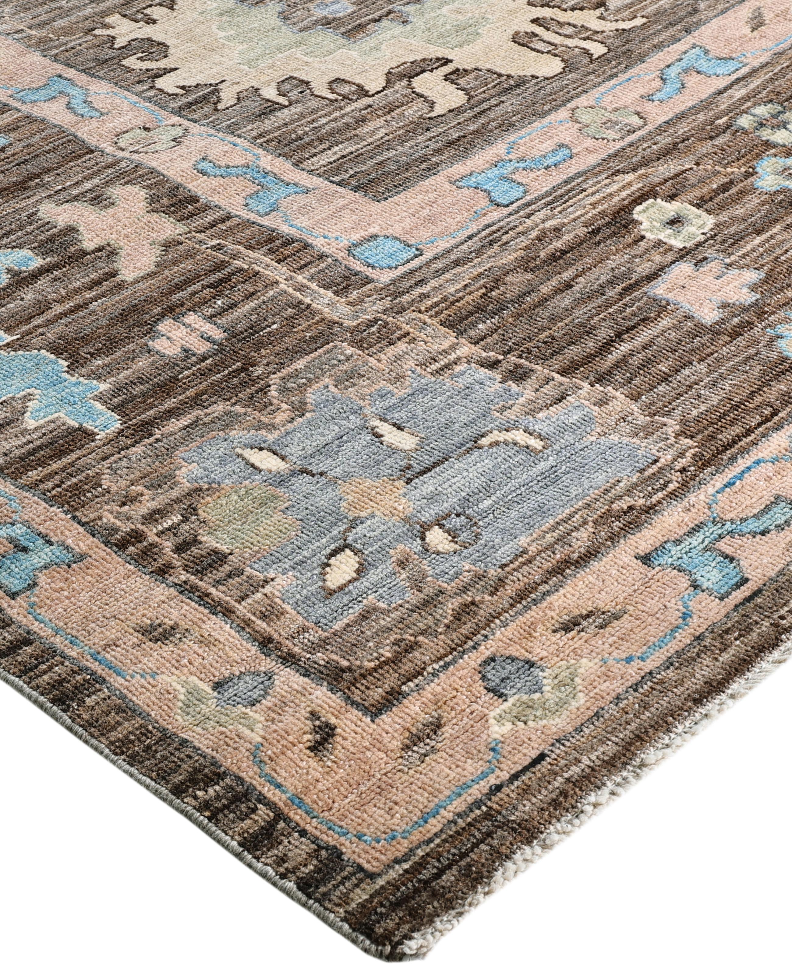 Oushak rugs are known for their soft, muted color palettes and large-scale, flowing designs. They often feature soft tones like beige, cream, gold, and light blue, with motifs that include palmettes, vines, and geometric shapes. These rugs are