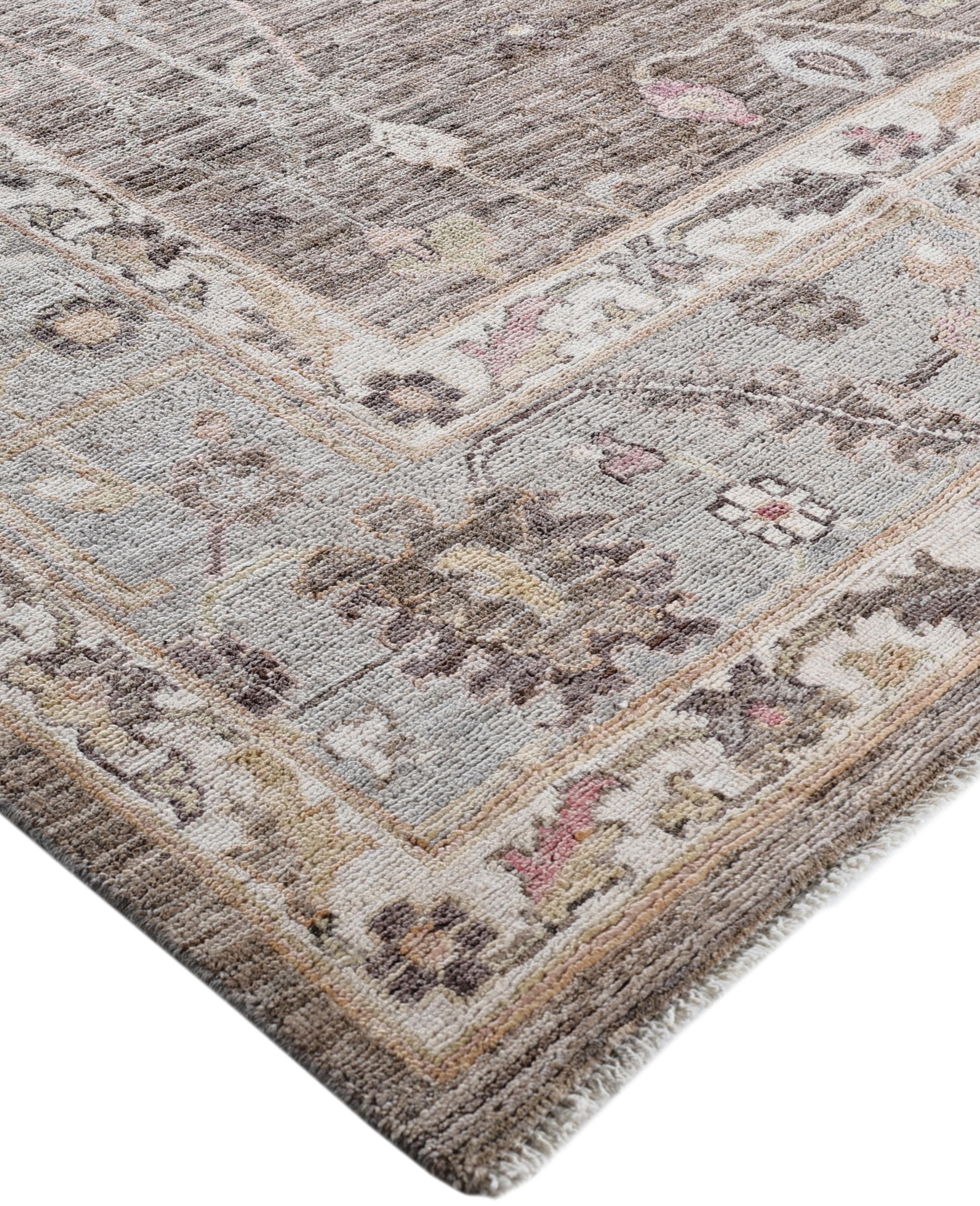 Oushak rugs are known for their soft, muted color palettes and large-scale, flowing designs. They often feature soft tones like beige, cream, gold, and light blue, with motifs that include palmettes, vines, and geometric shapes. These rugs are