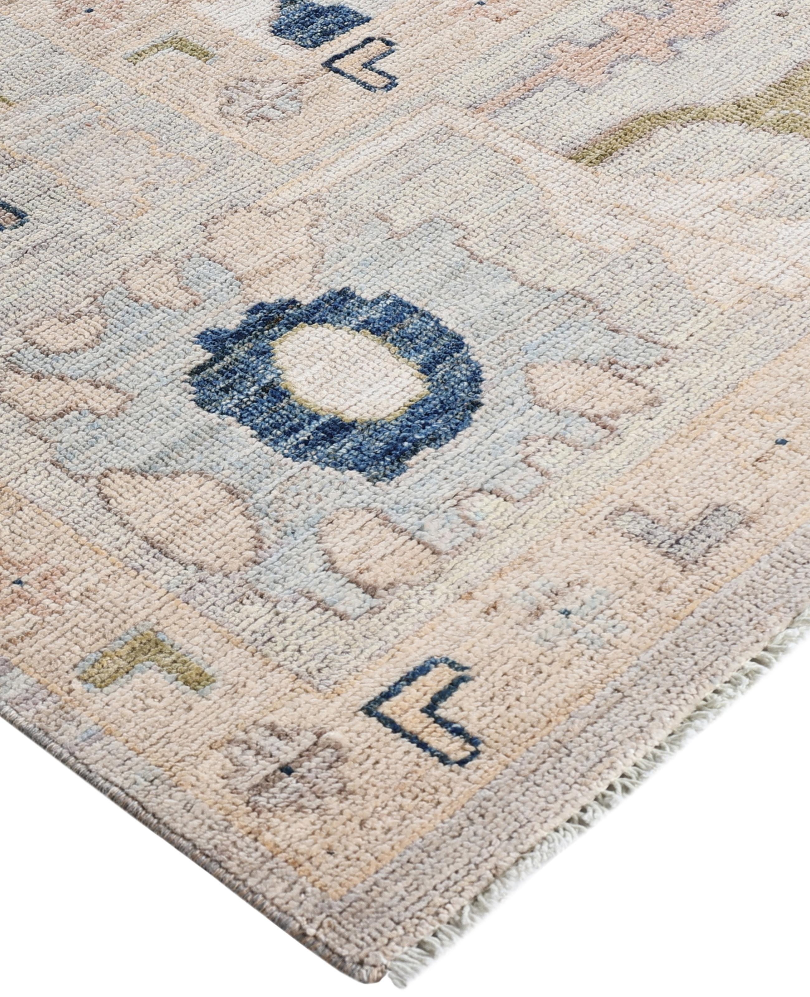 Oushak rugs are known for their soft, muted color palettes and large-scale, flowing designs. They often feature soft tones like beige, cream, gold, and light blue, with motifs that include palmettes, vines, and geometric shapes. These rugs are