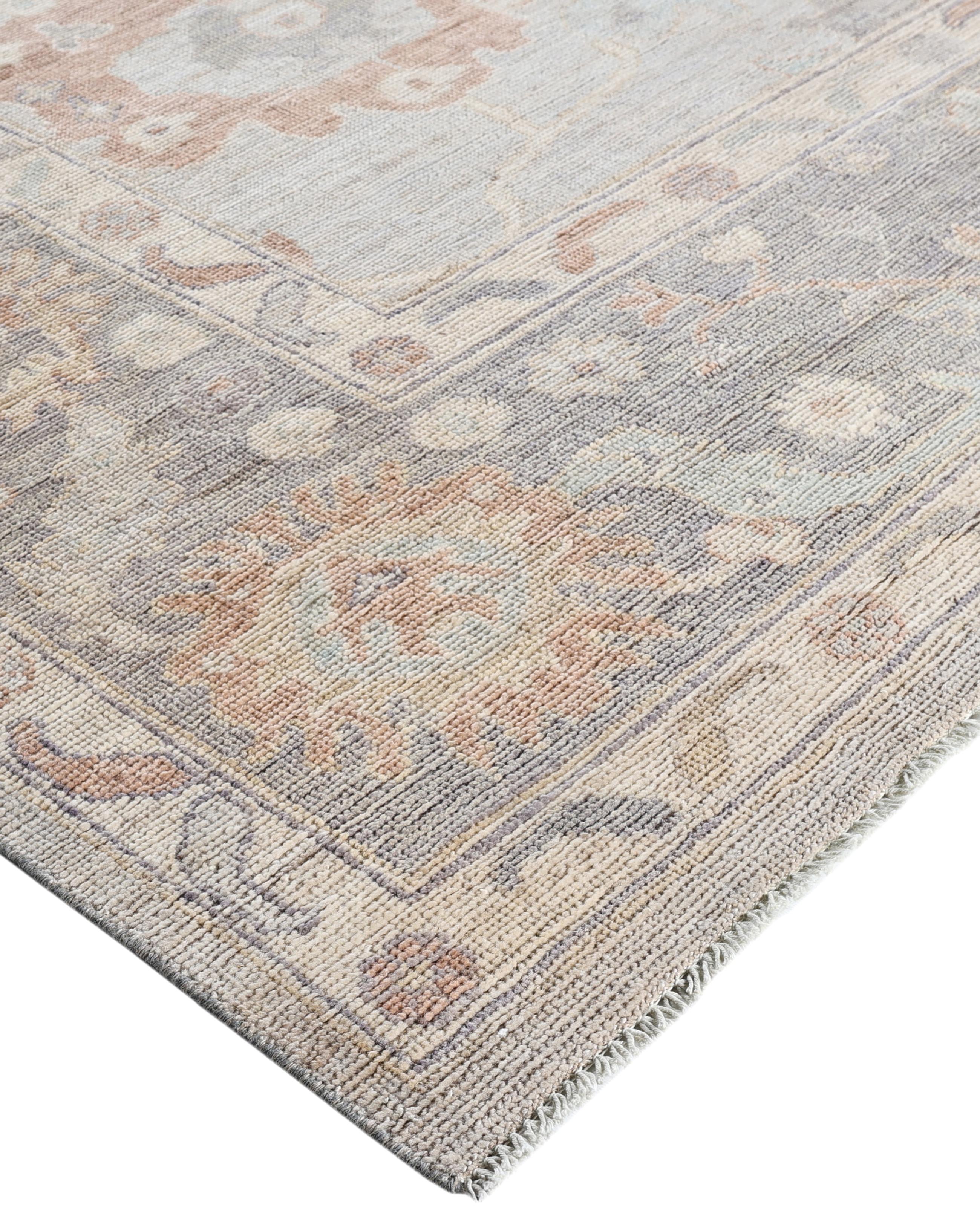 Oushak rugs are known for their soft, muted color palettes and large-scale, flowing designs. They often feature soft tones like beige, cream, gold, and light blue, with motifs that include palmettes, vines, and geometric shapes. These rugs are