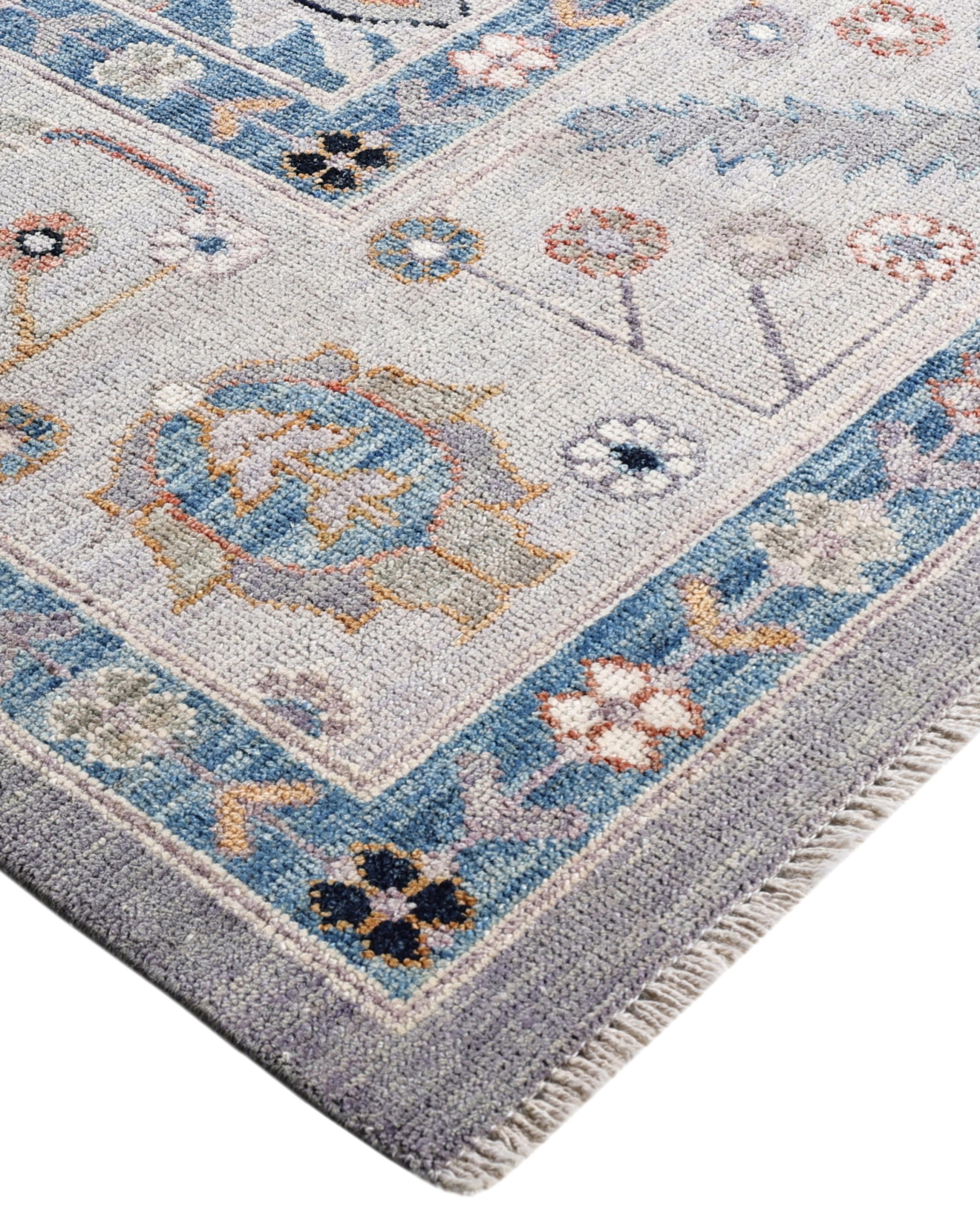 Oushak rugs are known for their soft, muted color palettes and large-scale, flowing designs. They often feature soft tones like beige, cream, gold, and light blue, with motifs that include palmettes, vines, and geometric shapes. These rugs are