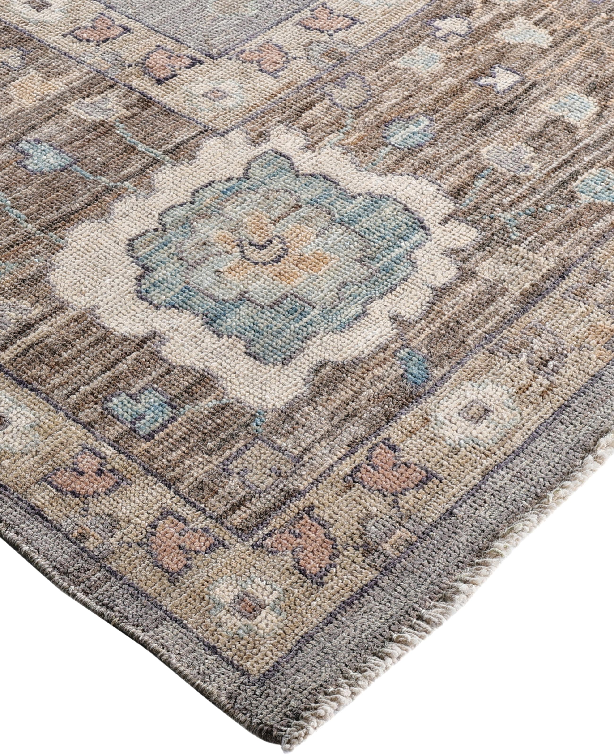Oushak rugs are known for their soft, muted color palettes and large-scale, flowing designs. They often feature soft tones like beige, cream, gold, and light blue, with motifs that include palmettes, vines, and geometric shapes. These rugs are