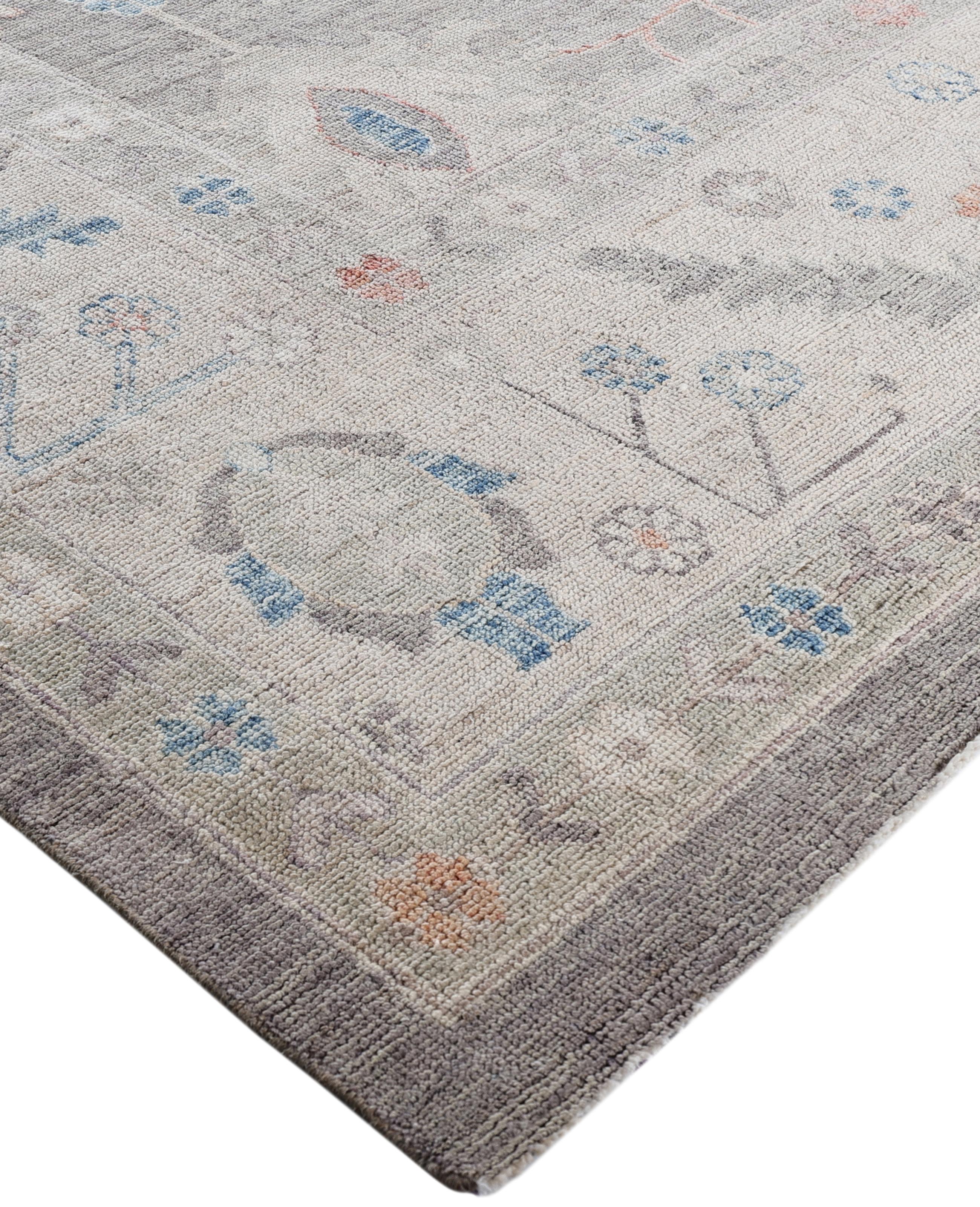 Oushak rugs are known for their soft, muted color palettes and large-scale, flowing designs. They often feature soft tones like beige, cream, gold, and light blue, with motifs that include palmettes, vines, and geometric shapes. These rugs are