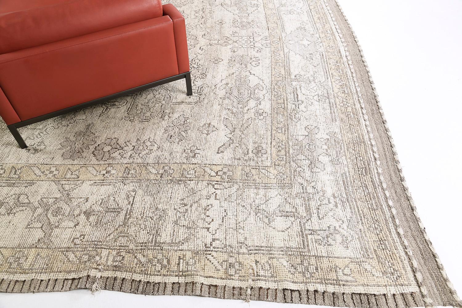 This dashing hand-spun wool revival of Oushak rug features all stylized symbolic elements and medallions are embodied with this design. It creates a soulful balance of everything from mid-century modern decor to old-fashioned design through a