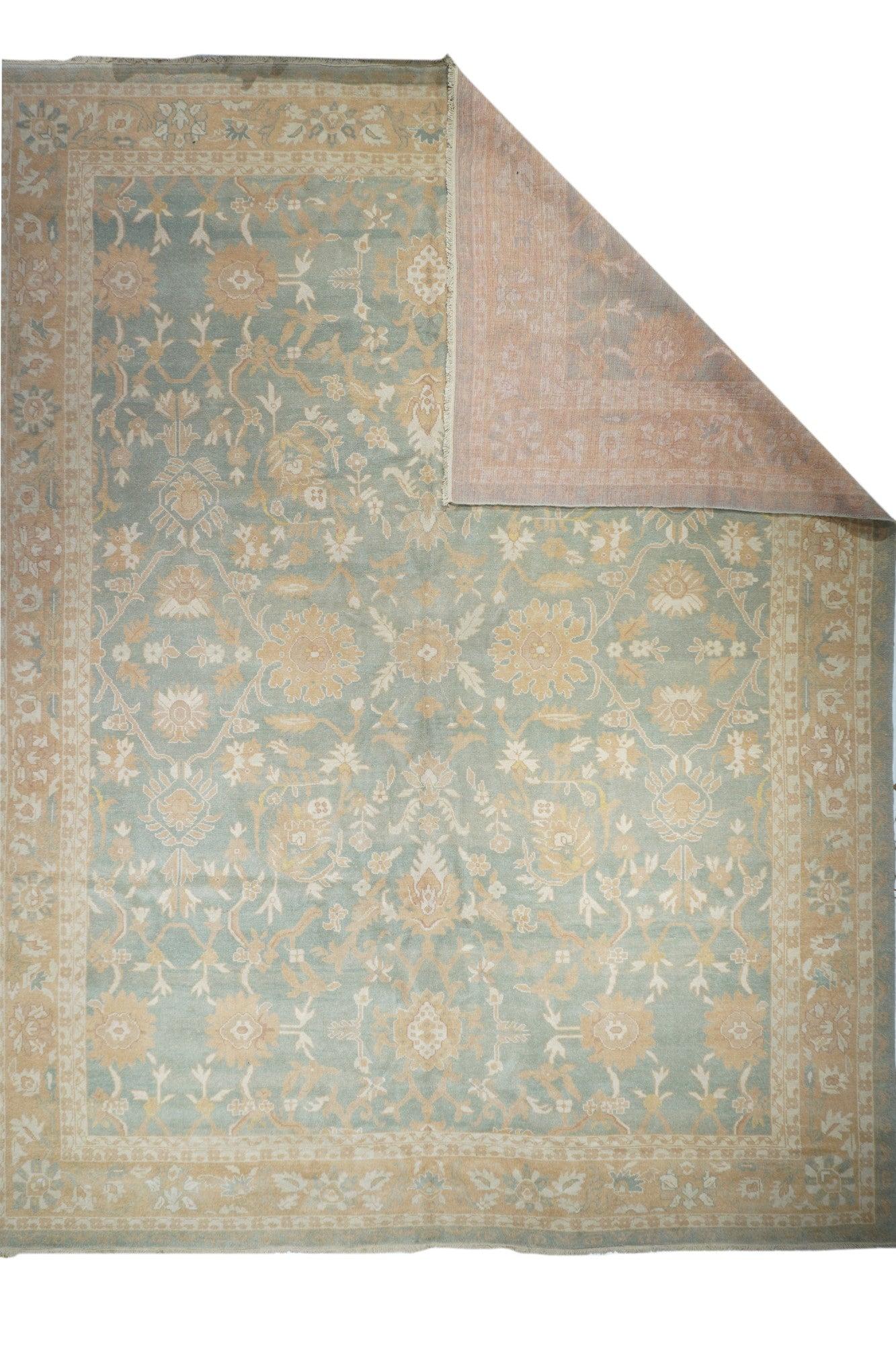 This recent west Turkish workshop carpet in a coarse weave, show an abrashed jade green field with a well-spaced allover, four-section pattern of large open hexagons, ragged palmettes, petal-fringed palmettes. and short leafy stems. Salmon-rust
