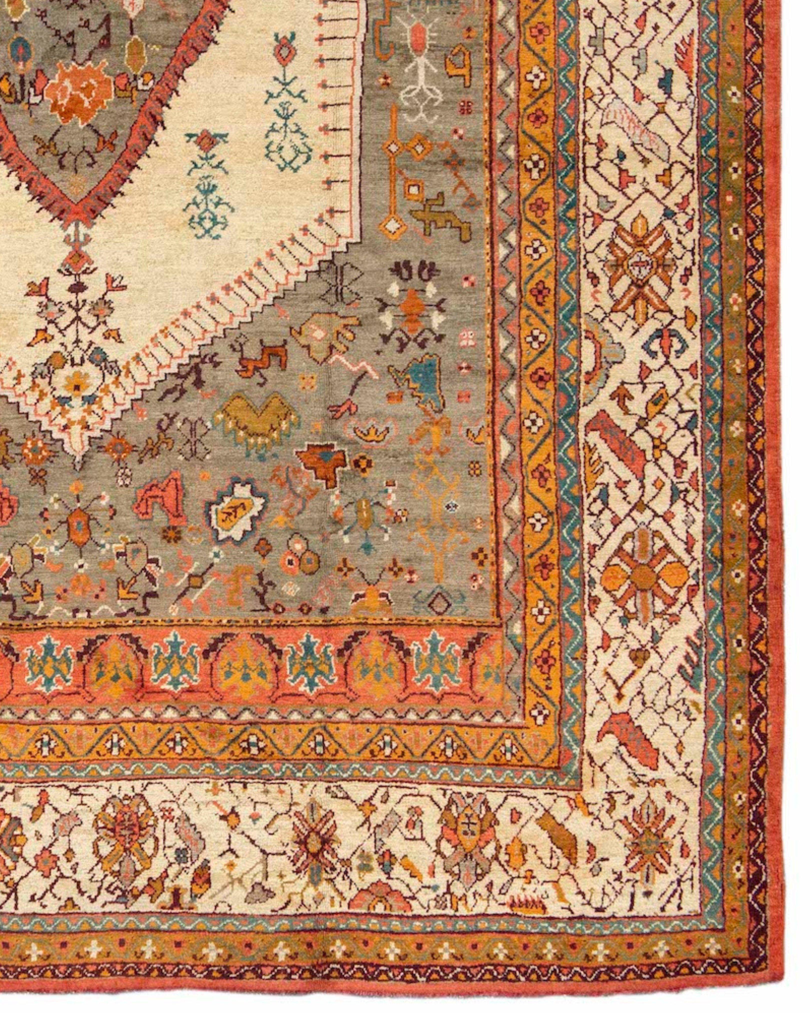 Antique Anatolian Oushak Rug, 19th Century

This pleasing Turkish Oushak carpet paints a rustic rendition of a classic medallion format. Soft wool is complemented by soft color using prominent creams and beige with accents in gold and coral.