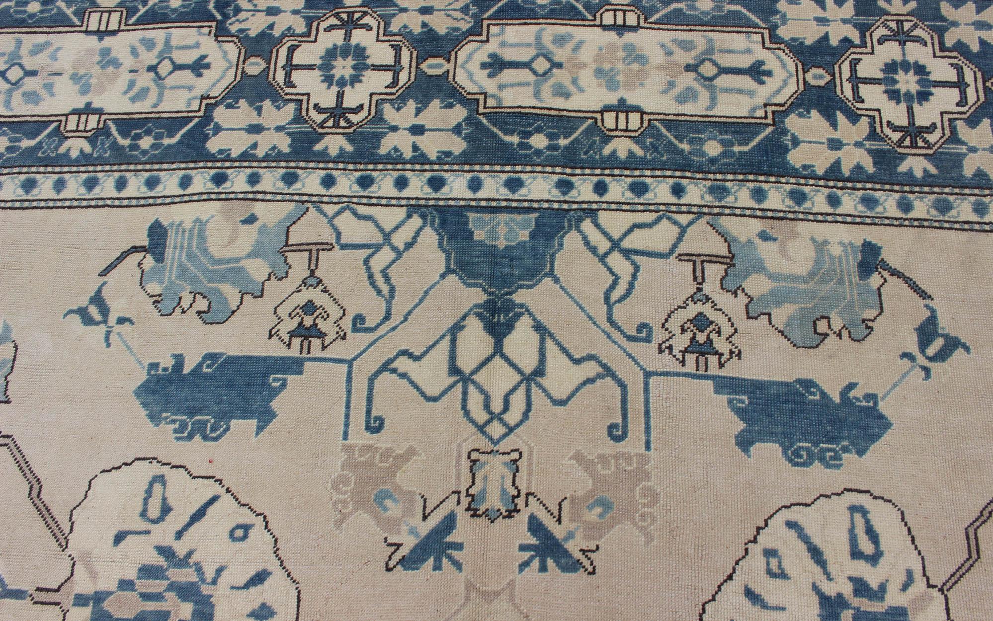 Oushak Rug from Mid-20th Century Turkey with Blue and Cream Tribal Design For Sale 1