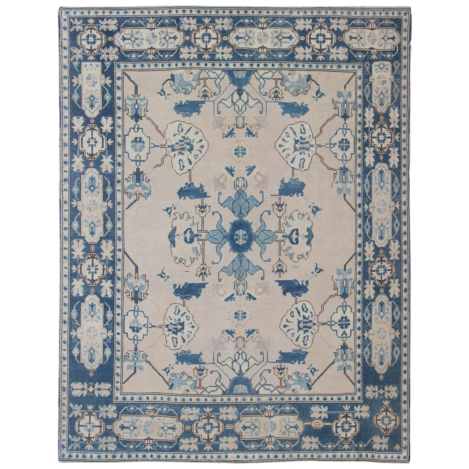 Oushak Rug from Mid-20th Century Turkey with Blue and Cream Tribal Design