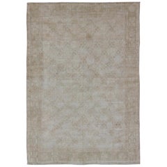 Vintage Oushak Rug with Light Color Palette and Repeating Flower Pattern