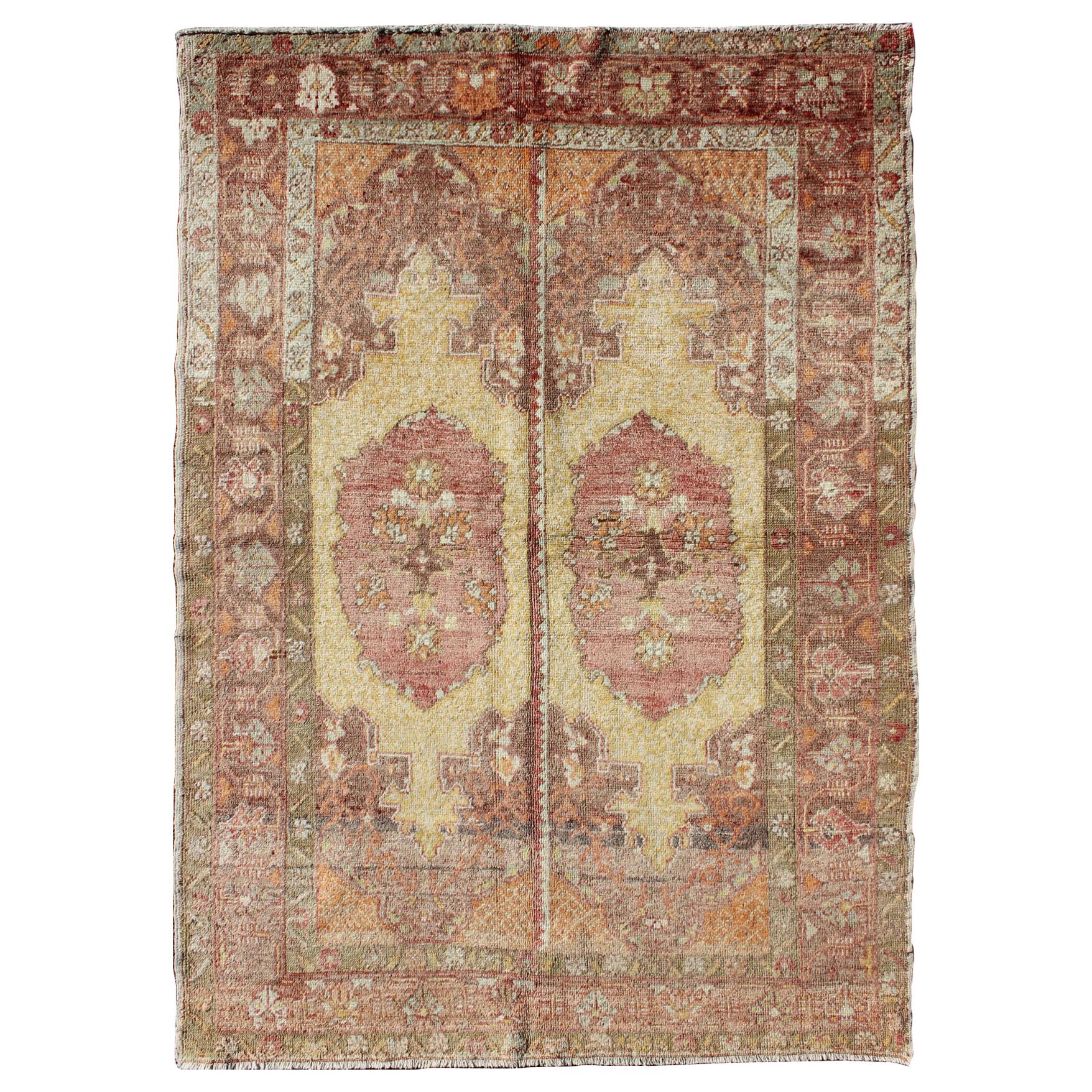 Oushak Rug with Two Medallion Panels in Yellow, Brown, Orange and Soft Red