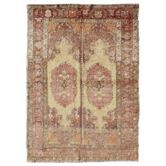 Vintage Oushak Rug with Two Medallion Panels in Yellow, Brown, Orange and Soft Red