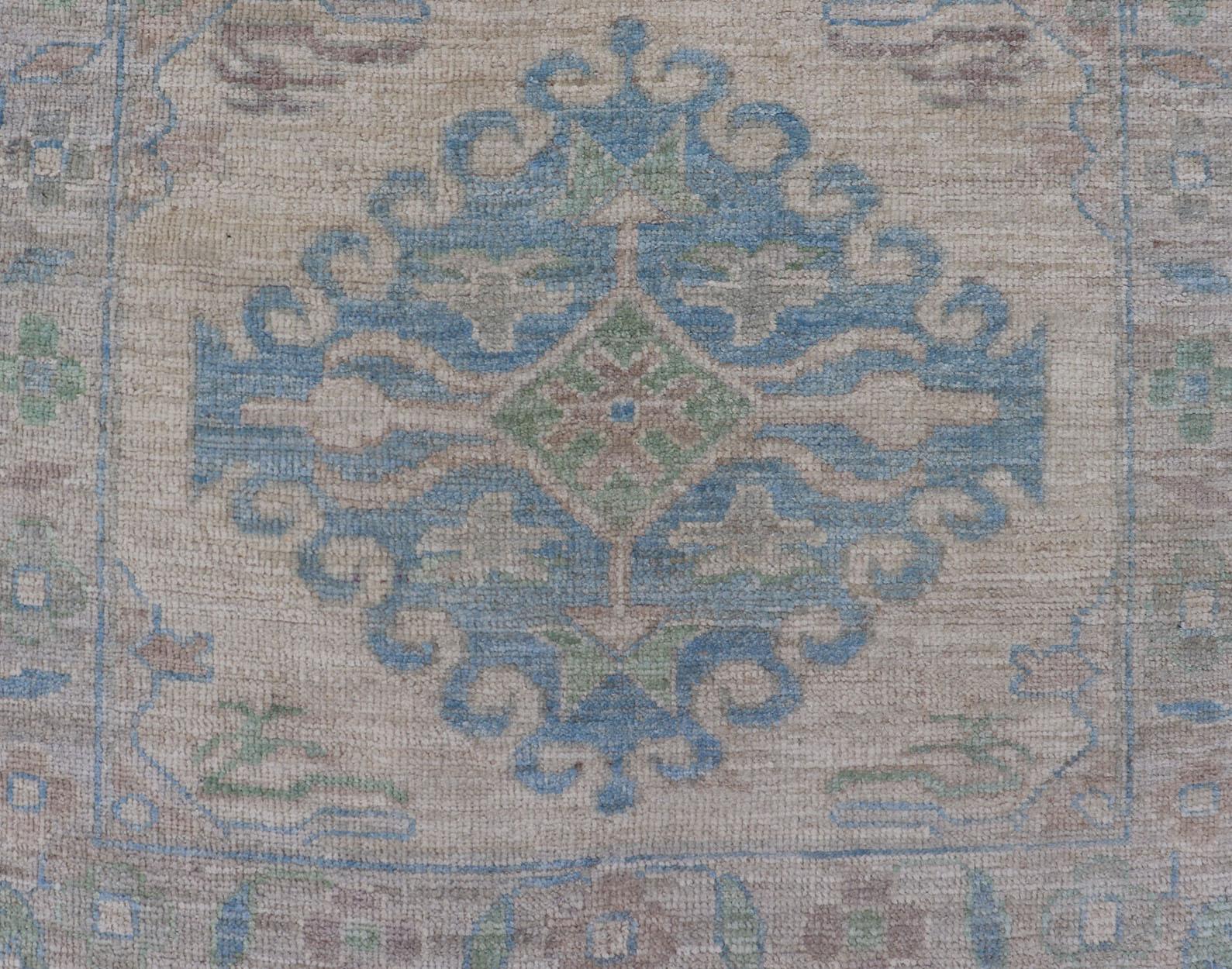Afghan Oushak Runner with Medallion Design on a Cream Field with Blues and Green