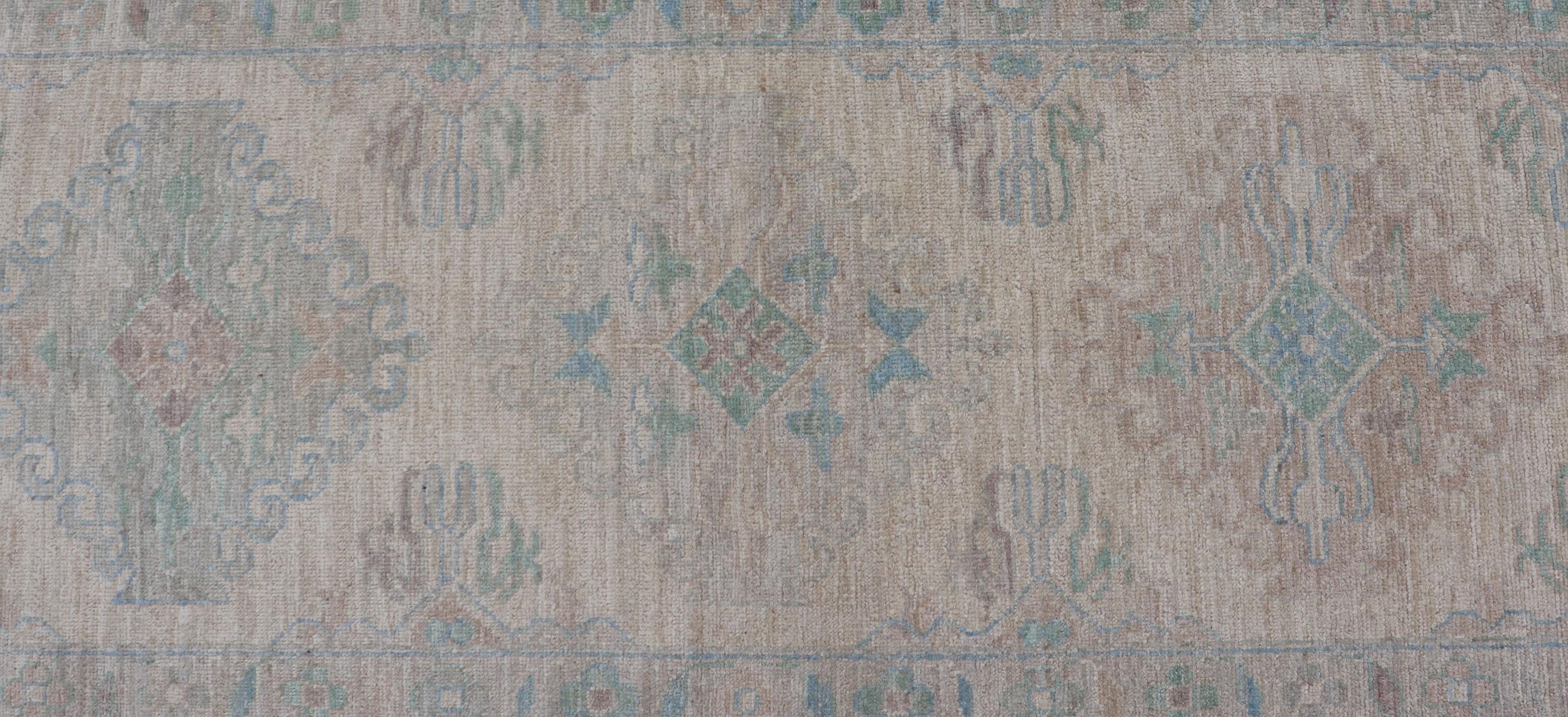 Hand-Knotted Oushak Runner with Medallion Design on a Cream Field with Blues and Green