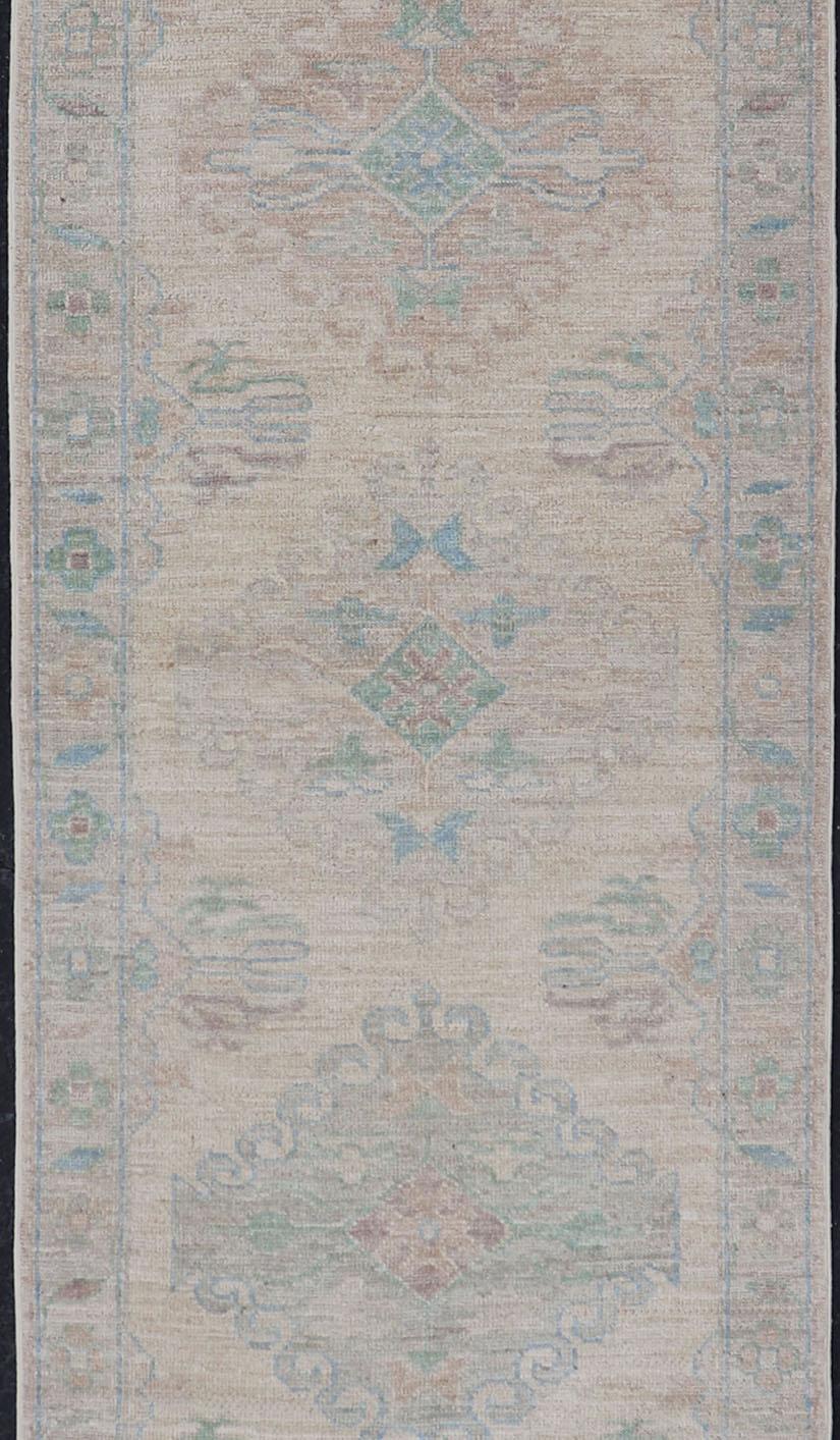 Contemporary Oushak Runner with Medallion Design on a Cream Field with Blues and Green
