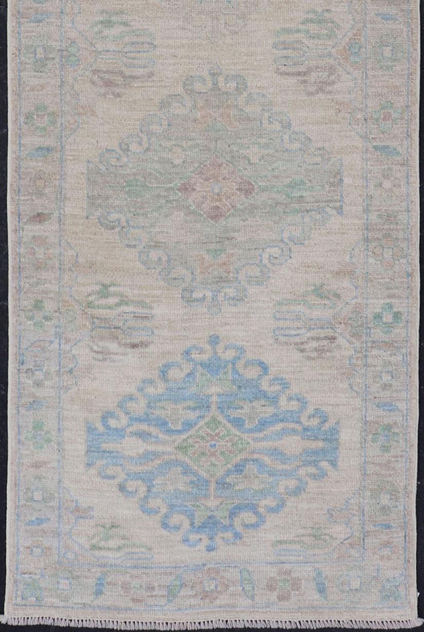 Wool Oushak Runner with Medallion Design on a Cream Field with Blues and Green