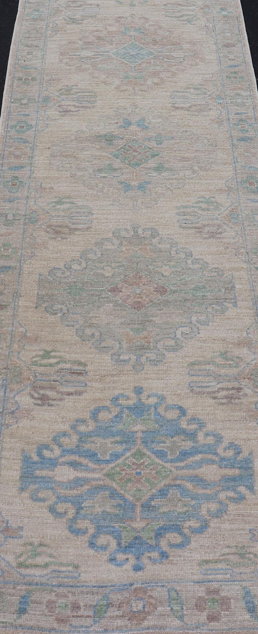 Oushak Runner with Medallion Design on a Cream Field with Blues and Green 1