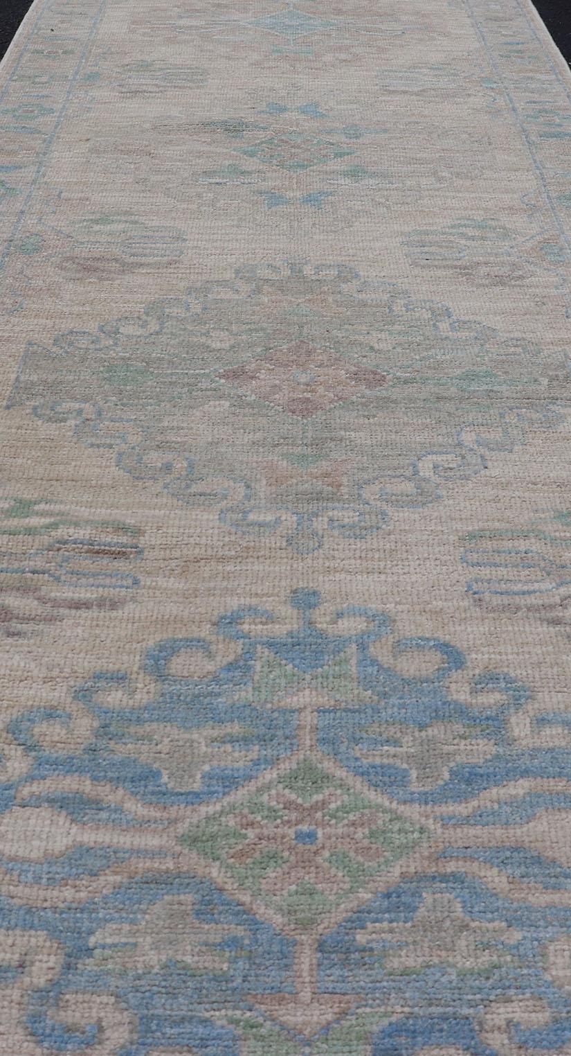 Oushak Runner with Medallion Design on a Cream Field with Blues and Green 2