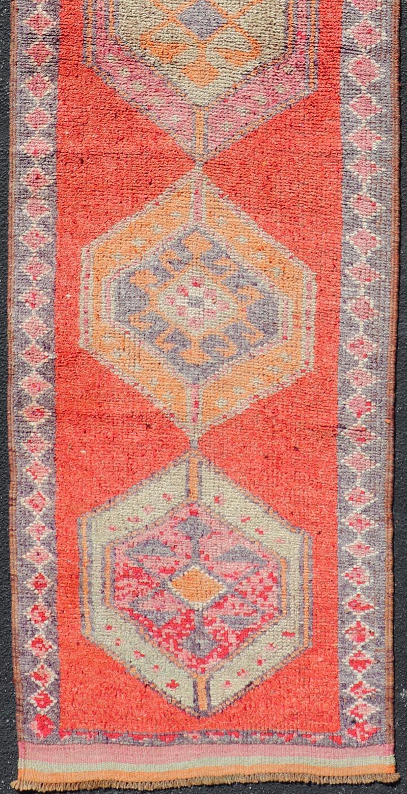20th Century Oushak Vintage Turkish Runner with Geometric Medallion Design with Orangey-Red For Sale