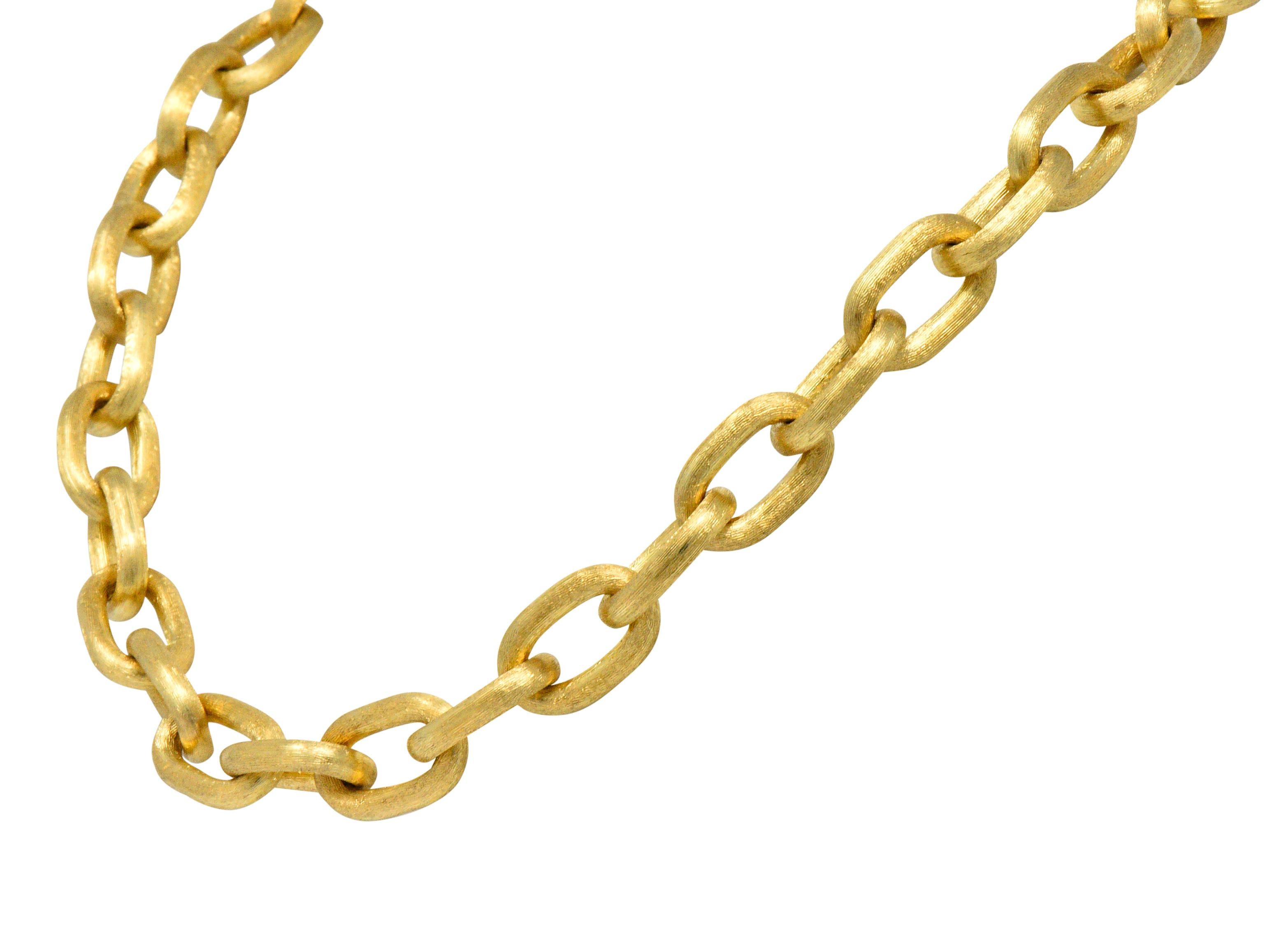 Necklace featuring large hollow oval links with a strong brushed finish

Completed by a concealed hinged clasp with figure-eight safety

Stamped Italy and 18kt for 18 karat gold

Length: 18 1/2 inches

Width: 1/2 (widest) inch

Total weight: 58.3