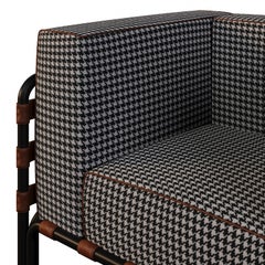 Poltrona da esterno con dettagli in pelle e tessuto a fantasia