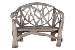 Panchina da esterno con rami di teak intrecciati