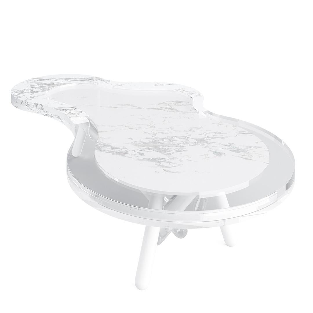 Ness - Outdoor center table 
Outdoor center table made with top: Carrara marble, Legs: clear acrylic and white lacquered stainless steel

Overlapping the lightness that its simple yet sophisticated design provides with the luxury that its acrylic
