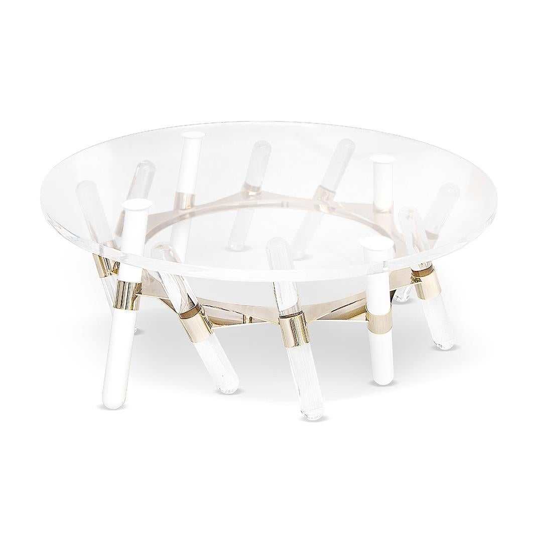 Houdini, outdoor center table

The whole design of this sophisticated outdoor center table was developed according to the following structure: 
-Metallic structure: Gold Plated stainless steel;
-Top: Clear acrylic;
-Rods: Clear acrylic.

All Myface