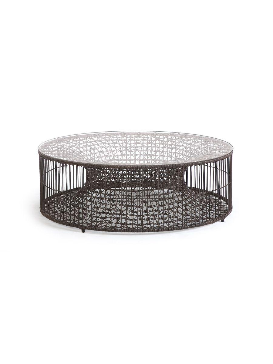 Amaya coffee table by Kenneth Cobonpue
Materials: Polyethelene. Steel. Glass.
Dimensions: Diameter 102cm x height 34cm.

Inspired by fish traps, the Amaya tables resemble a vortex enclosed within a cylinder. While the indoor version is crafted