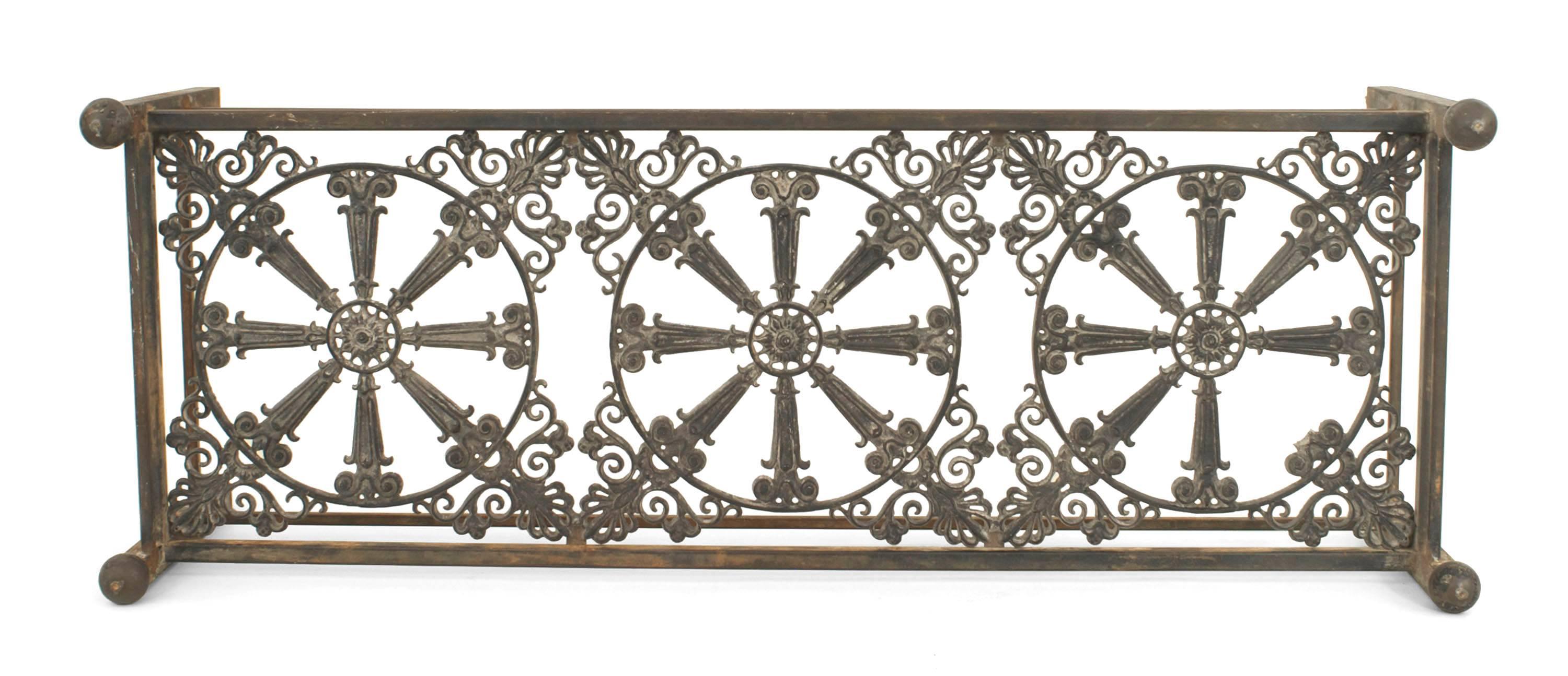 Outdoor Continental-style (19th Century) large rectangular iron base coffee table with an iron filigree shelf under a glass top.
