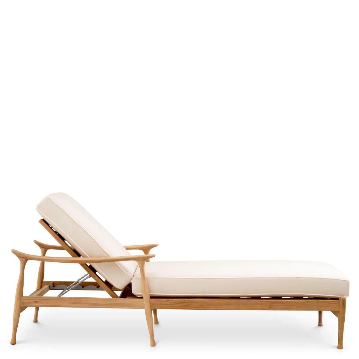 This outdoor daybed in natural teak is designed to bring comfort, durability, and refined simplicity to any exterior space. Crafted from solid teak, the teak outdoor daybed naturally resists weather, humidity, and temperature variations, making it