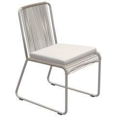 Outdoor Dining Chair by RODA in Milk and Sand Color with Ivory Seat Cushion
