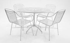 Outdoor Dining Table and Four Arm Chairs by John Salterini