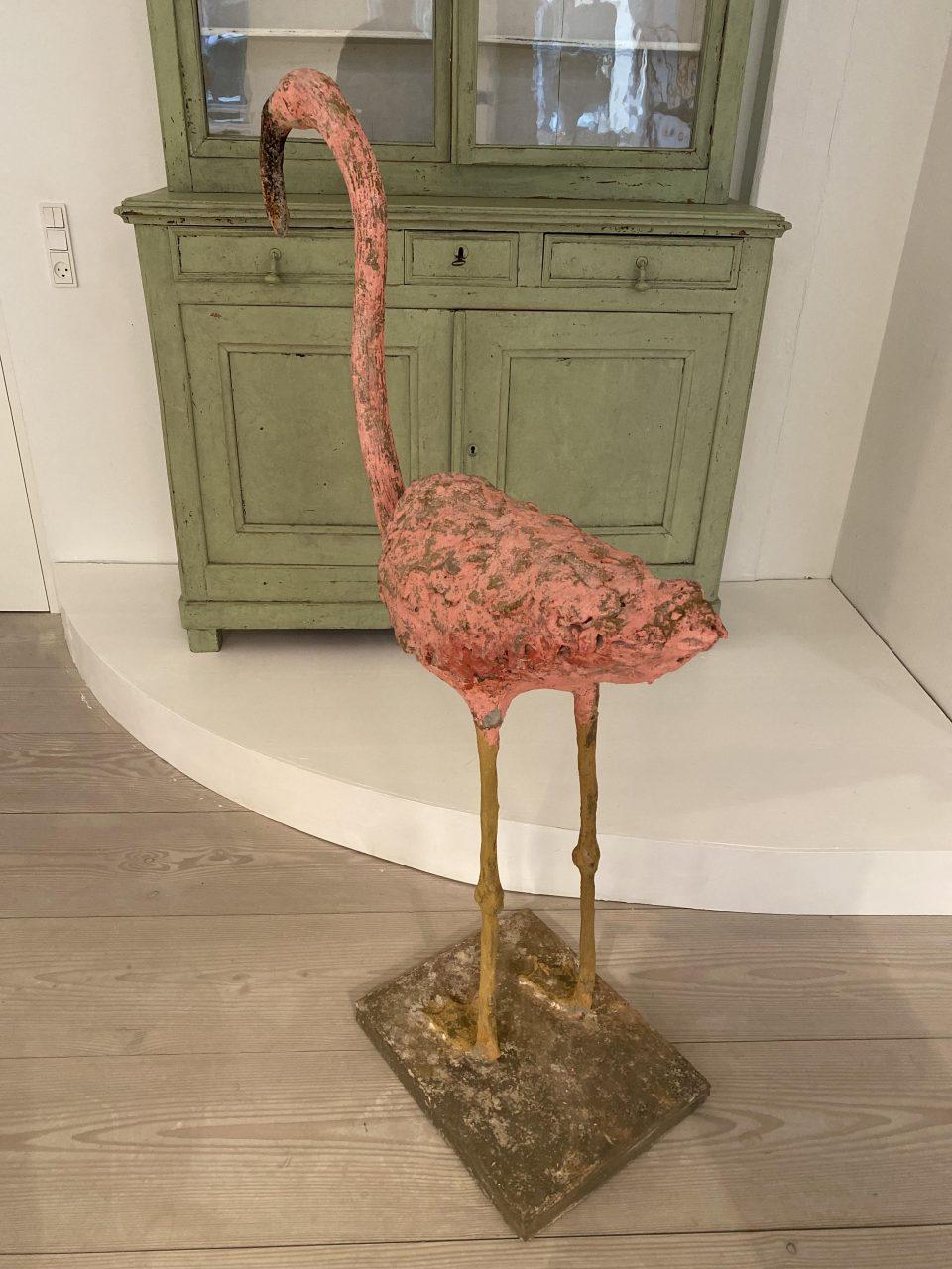 Festive and whimsical mid-century French figure, from the South of France. Formed in cast cement in the shape of a flamingo, this figure was made back in the 1950s-60s, and has the well-known curved neck, pink plumage and thin legs. Puts a smile to