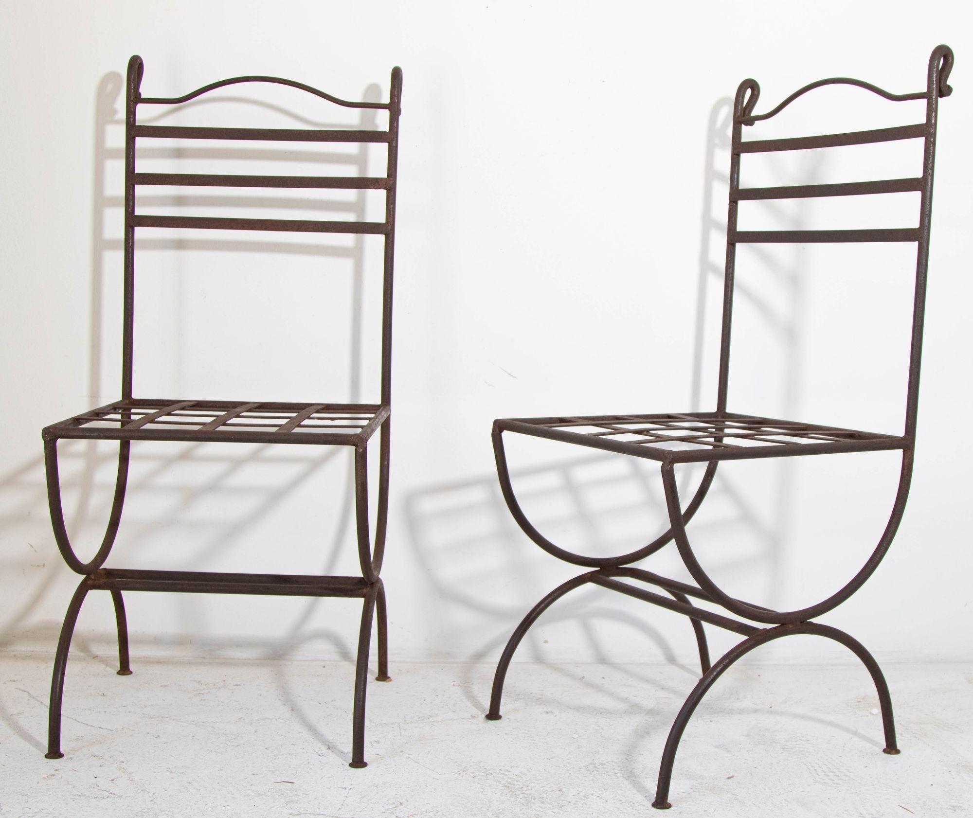 Vintage Hand forged wrought-Iron Outdoor French Provincial Chairs.
Handcrafted pair of wrought iron garden or patio chairs.
A wonderful take on Classic outdoor patio furniture, hand-crafted, wrought iron chairs with latticed seat.
An impressive