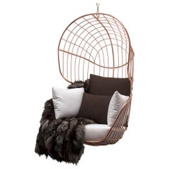 Silla de exterior de acero inoxidable con detalles de cobre