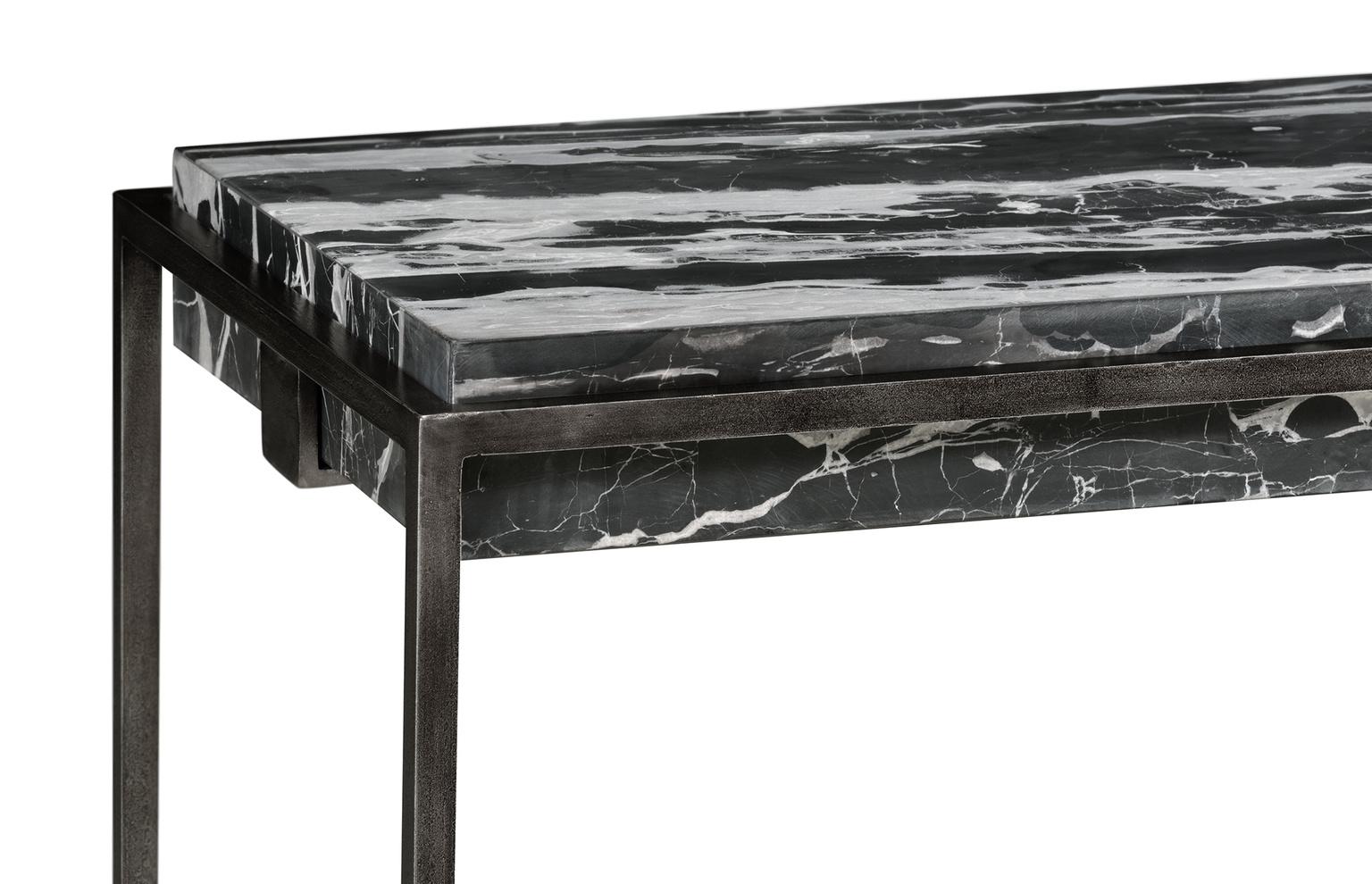 Available as a set of two tables, each contemporary piece features a frame in antique pewter iron and a black marble top. Each set is comprised of one rectangular table and one square table, at the same height, the tables can be artistically placed