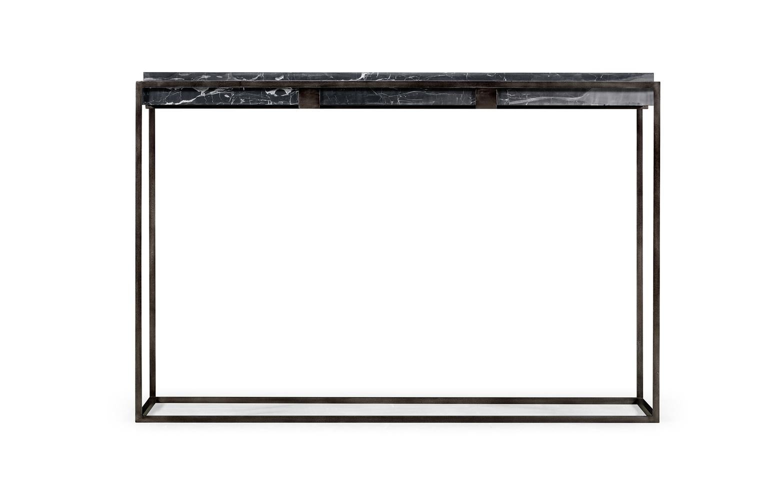 A contemporary rectangular console table featuring an antiqued pewter iron base and a black marble-top. Materials are durably tested and approved to withstand extreme weather conditions making this console a perfect candidate for outdoor design as