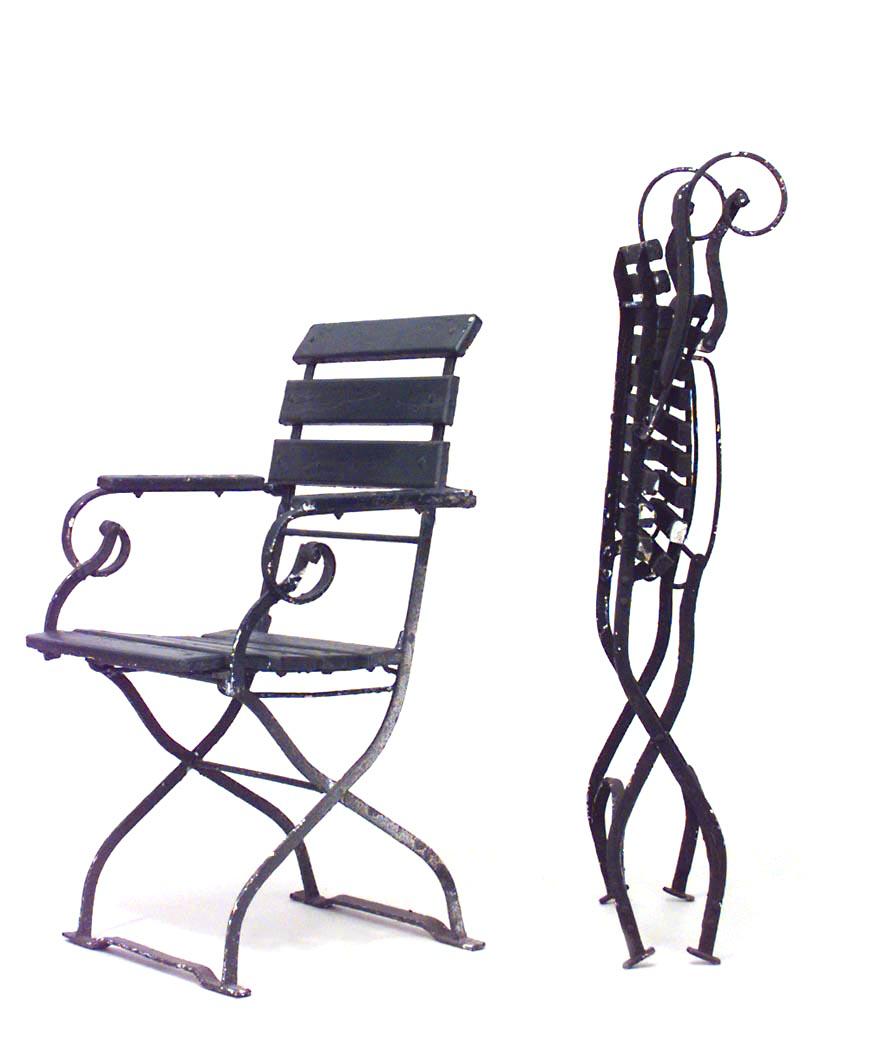 9 outdoor iron folding armchairs with scroll design and slat seat and back. (19th-20th century) (priced each).