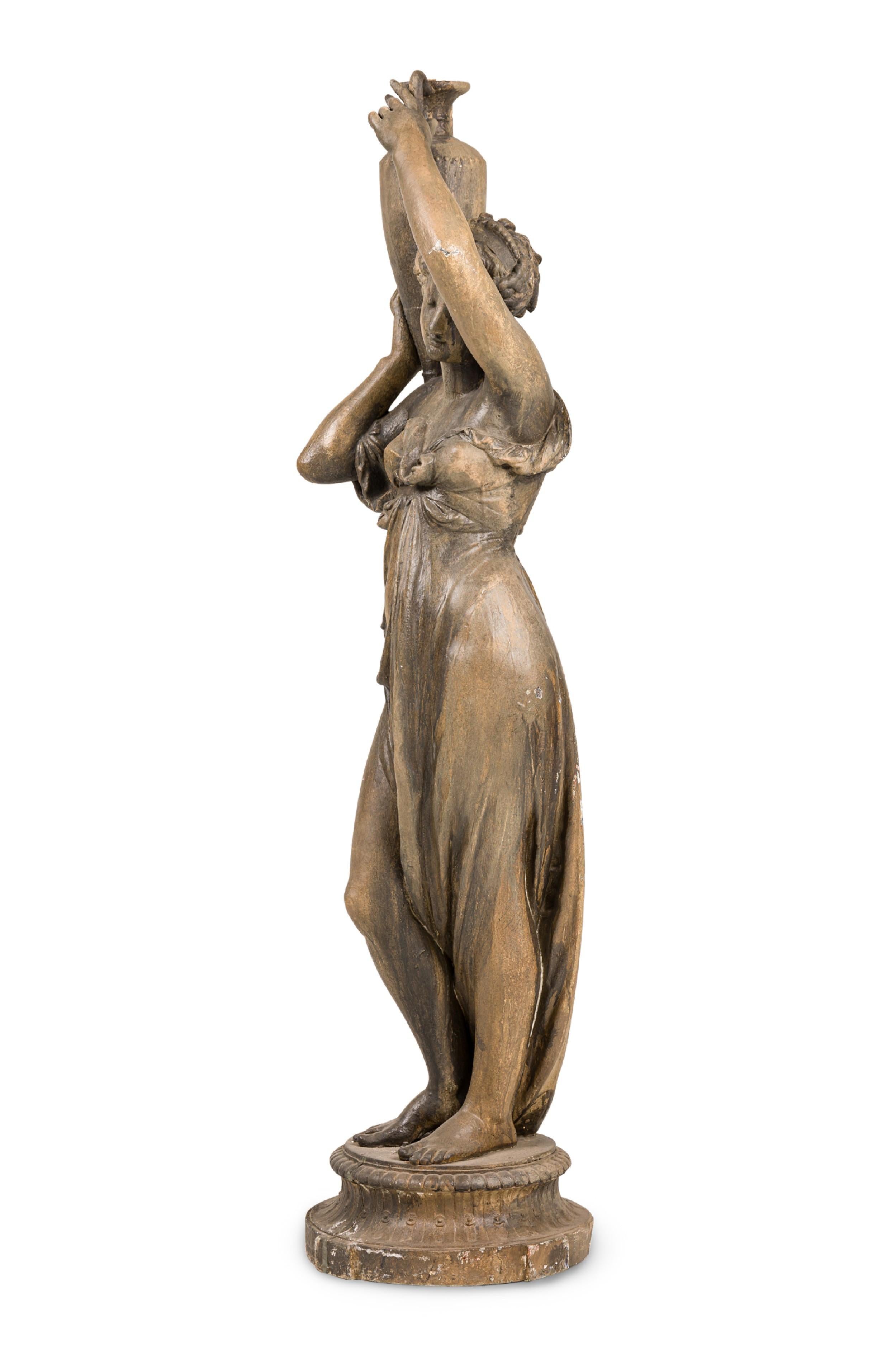 Outdoor painted iron large classic Greek woman holding urn on shoulder (19/20th Cent) (Please note this piece has been outdoors and has since become brown and gray coloring)

Condition: (This item has been painted stone gray.)