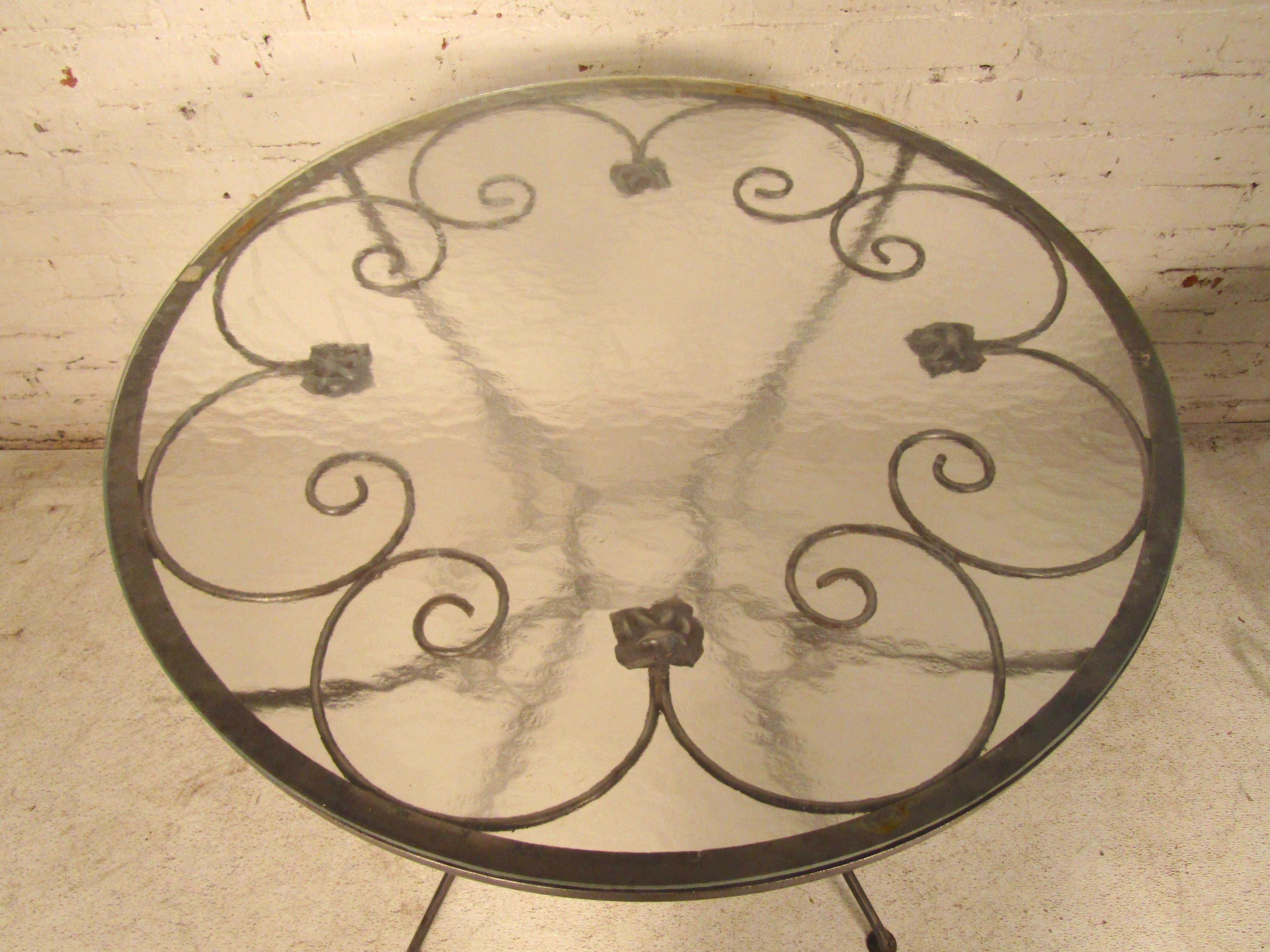 Metal patio table with glass. Attractive detailing and slender lines throughout. Refinished in a bare metal style finish.
(Please confirm item location - NY or NJ - with dealer).
 