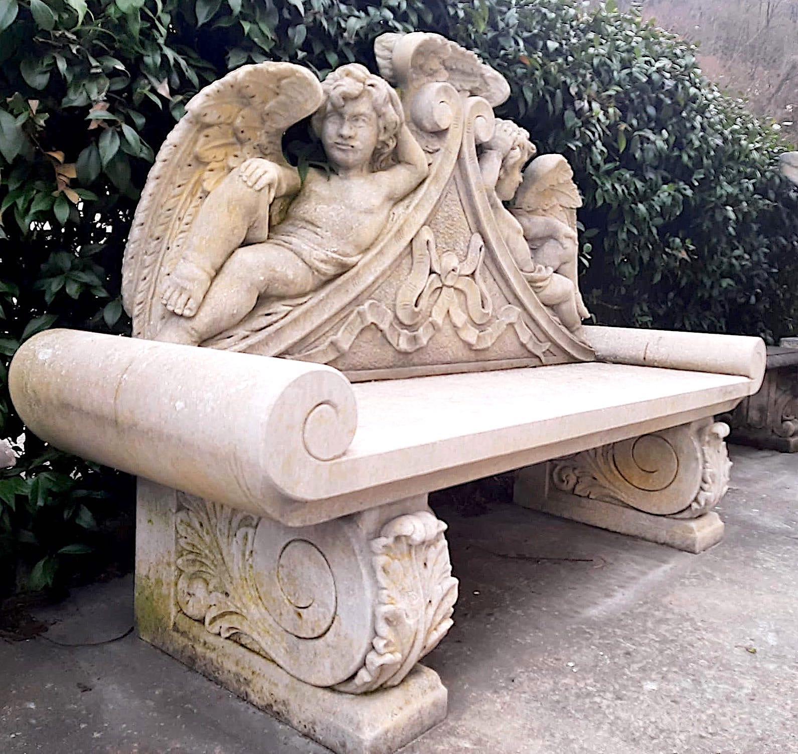 Exceptional Italian craftsmanship with stunning motifs of delicious winged Putti figures in limestone, 
 enriched with garland and leaves. 
Great decoration for Garden and Patio furniture.
 We can disassemble the bench and prepare the packaging in a