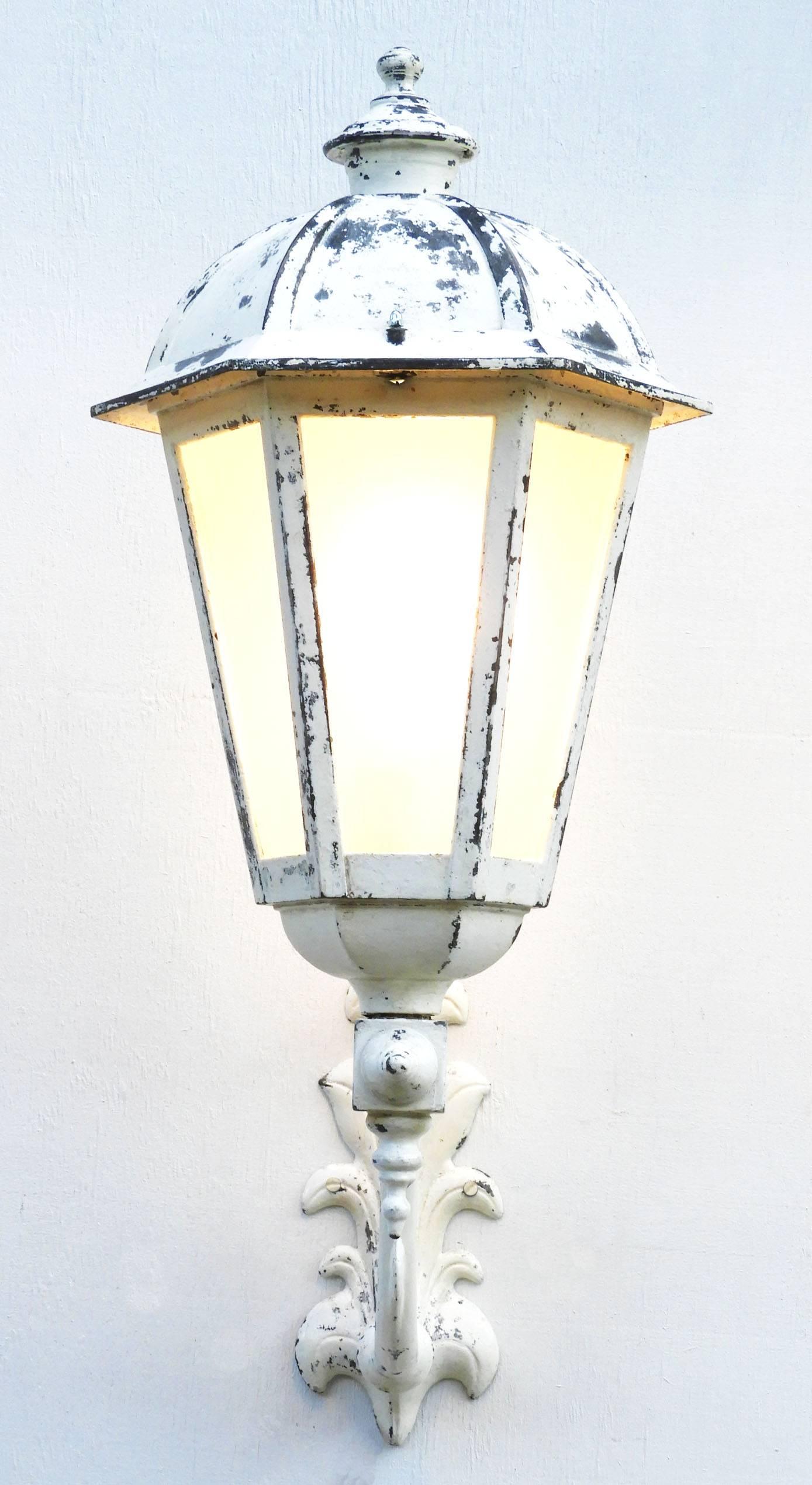 French lantern exterior porch wall light with frosted glass
Vintage 20th century
Paint work gloriously weathered by time or easy to refinish as preferred.
This will be re-wired and tested to USA or UK and European standards ready to install, or