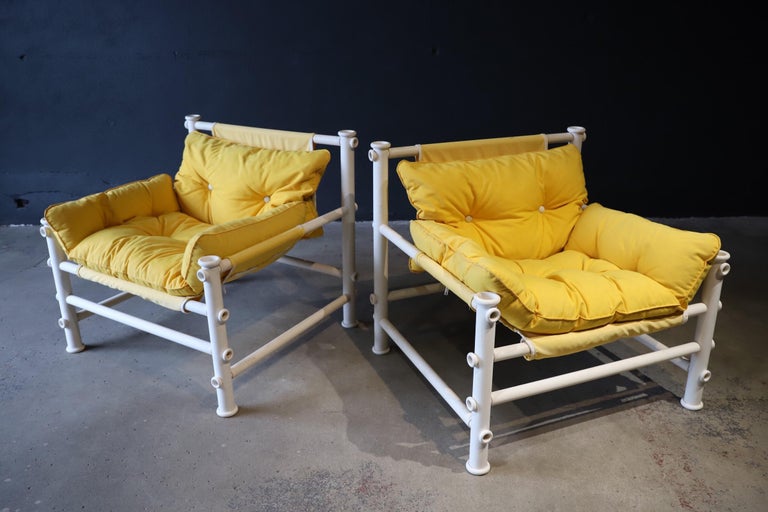 Super fun, bright yellow outdoor lounge chairs designed by Jerry Johnson for Landes Manufacturing Co. Chairs were not produced in massive quantities, so tend to be rarely sold/seen/found. PVC chair frame with detachable padded outdoor Sunbrella