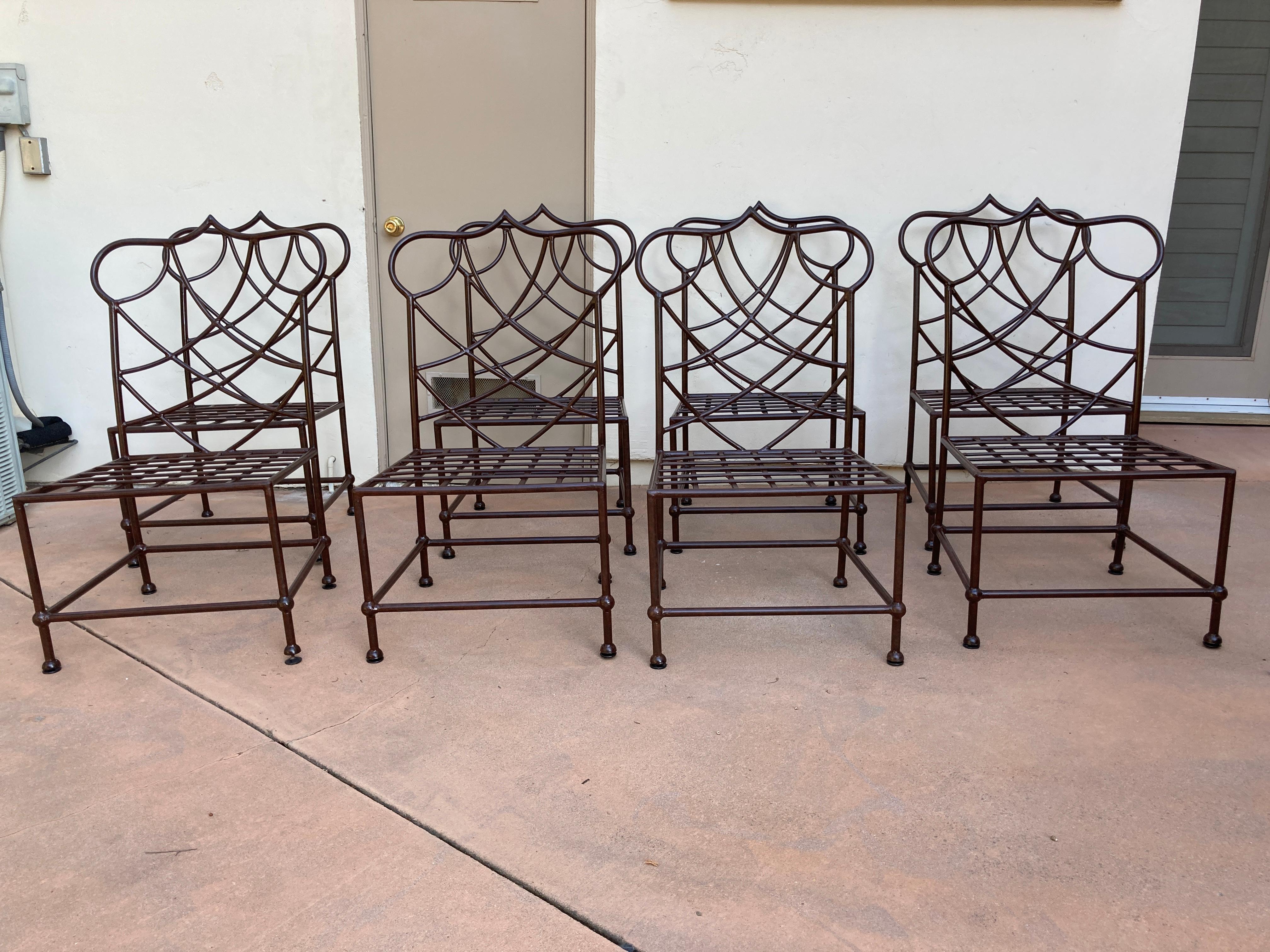Custom made outdoor metal chairs set of eight, powder coated with rust iron color.
One of a kind, large vintage chairs hand crafted custom found in a large estate in Santa Barbara.
Great Moorish arched back with openwork design.
The chairs have